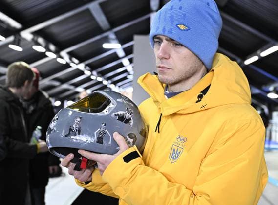 Milan Cortina Olympics: Ukrainian athlete disqualified from games Ukrainian skeleton racer Vladyslav Heraskevych meets the press in Cortina d Ampezzo, Italy, on Feb. 12, 2026, after being disqualified from competition at the Milan Cortina Olympics for pledging to wear a helmet displaying images of athletes who were killed during Russian attacks on Ukraine.  A14AA0005274186P