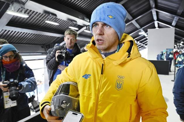 Milan Cortina Olympics: Ukrainian athlete disqualified from games Ukrainian skeleton racer Vladyslav Heraskevych meets the press in Cortina d Ampezzo, Italy, on Feb. 12, 2026, after being disqualified from competition at the Milan Cortina Olympics for pledging to wear a helmet displaying images of athletes who were killed during Russian attacks on Ukraine.  A14AA0005274189P