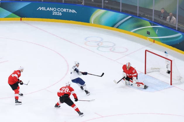 February 12, 2026, Milan, Lombardy, Italy: Goalie LEONARDO GENONI 63 of Team Switzerland makes a save on a shot by JORDANN PERRET 72 of Team France in the Men s Preliminary Round Group A game between Team Switzerland (SUI) and Team France (FRA) at the Milano Cortina 2026 Winter Olympic Games, Olympische Spiele, Olympia, OS Milan Italy - ZUMAc179 20260212_oly_c179_004 Copyright: xMickaelxChavetx