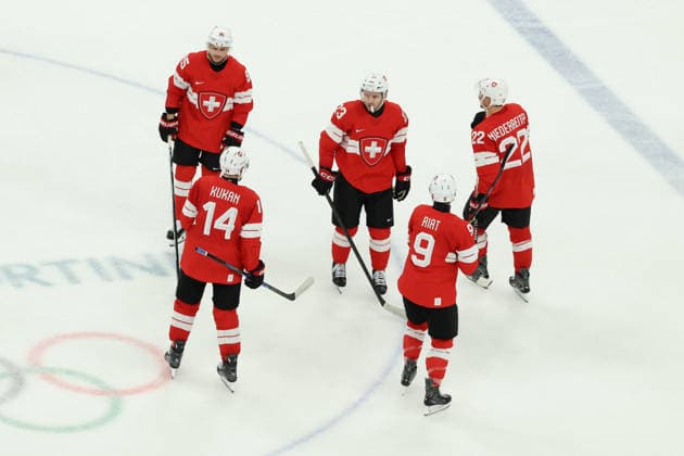 February 12, 2026, Milan, Lombardy, Italy: TEAM SWITZERLAND PLAYERS react in the Men s Preliminary Round Group A game between Team Switzerland (SUI) and Team France (FRA) at the Milano Cortina 2026 Winter Olympic Games, Olympische Spiele, Olympia, OS Milan Italy - ZUMAc179 20260212_oly_c179_031 Copyright: xMickaelxChavetx
