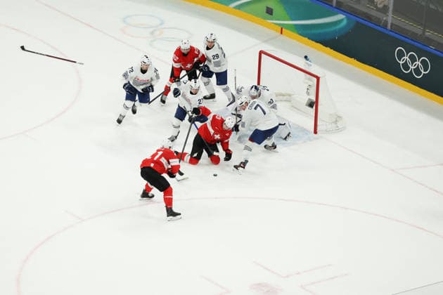 February 12, 2026, Milan, Lombardy, Italy: Team Switzerland nearly scored its third goal during the second period of the Men s Preliminary Round Group A game between Team Switzerland (SUI) and Team France (FRA) at the Milano Cortina 2026 Winter Olympic Games, Olympische Spiele, Olympia, OS Milan Italy - ZUMAc179 20260212_oly_c179_037 Copyright: xMickaelxChavetx