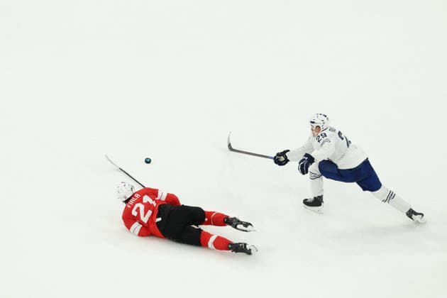 February 12, 2026, Milan, Lombardy, Italy: KEVIN FIALA 21 of Switzerland and LOUIS BOUDON 29 of France in the Men s Preliminary Round Group A game between Team Switzerland (SUI) and Team France (FRA) at the Milano Cortina 2026 Winter Olympic Games, Olympische Spiele, Olympia, OS Milan Italy - ZUMAc179 20260212_oly_c179_038 Copyright: xMickaelxChavetx