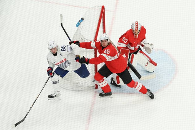 February 12, 2026, Milan, Lombardy, Italy: MICHAEL FORA 45 of Switzerland and ALEXANDRE TEXIER 85 of France in the Men s Preliminary Round Group A game between Team Switzerland (SUI) and Team France (FRA) at the Milano Cortina 2026 Winter Olympic Games, Olympische Spiele, Olympia, OS Milan Italy - ZUMAc179 20260212_oly_c179_040 Copyright: xMickaelxChavetx