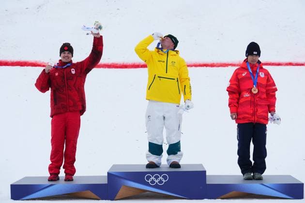 February 12, 2026, Livigno, Italy: From left, silver medalist Canada s Mikael Kingsbury, gold medalist Australia s Cooper Woods and bronze medalist Japan s Ikuma Horishima celebrate after the men s freestyle skiing moguls finals at the 2026 Winter Olympics, in Livigno, Italy, Thursday, Feb. 12, 2026. Canada News - February 12, 2026  - ZUMAc35_ 20260212_zaf_c35_037 Copyright: xSeanxKilpatrickx