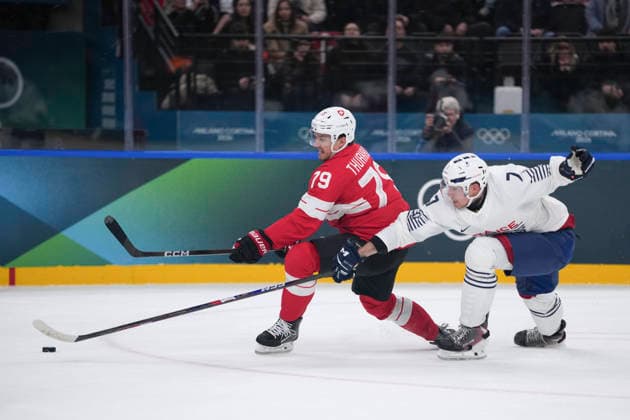 (260212) -- MILAN, Feb. 12, 2026 -- Calvin Thurkauf (L) of Switzerland competes with Pierre Crinon of France during the Ice hockey, Eishockey men s preliminary round group A match between Switzerland and France at the Milan-Cortina 2026 Olympic Winter games, Winterspiele,Spiele, Summer games in Milan, Italy, Feb. 12, 2026. ) (MICO2026)ITALY-MILAN-OLYMPIC WINTER GAMES-ICE HOCKEY-MEN-PRELIMINARY-SUI VS FRA TaoxXiyi 
