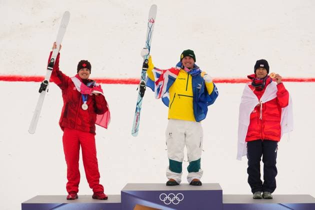 February 12, 2026, Livigno, Italy: From left, silver medalist Canada s Mikael Kingsbury, gold medalist Australia s Cooper Woods and bronze medalist Japan s Ikuma Horishima celebrate after the men s freestyle skiing moguls finals at the 2026 Winter Olympics, in Livigno, Italy, Thursday, Feb. 12, 2026. Canada News - February 12, 2026  - ZUMAc35_ 20260212_zaf_c35_043 Copyright: xSeanxKilpatrickx
