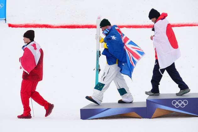 February 12, 2026, Livigno, Italy: From left, silver medalist Canada s Mikael Kingsbury, gold medalist Australia s Cooper Woods and bronze medalist Japan s Ikuma Horishima leave the podium after the men s freestyle skiing moguls finals at the 2026 Winter Olympics, in Livigno, Italy, Thursday, Feb. 12, 2026. Canada News - February 12, 2026  - ZUMAc35_ 20260212_zaf_c35_044 Copyright: xSeanxKilpatrickx