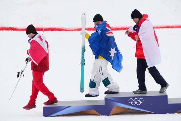 February 12, 2026, Livigno, Italy: From left, silver medalist Canada s Mikael Kingsbury, gold medalist Australia s Cooper Woods and bronze medalist Japan s Ikuma Horishima leave the podium after the men s freestyle skiing moguls finals at the 2026 Winter Olympics, in Livigno, Italy, Thursday, Feb. 12, 2026. Canada News - February 12, 2026  - ZUMAc35_ 20260212_zaf_c35_045 Copyright: xSeanxKilpatrickx