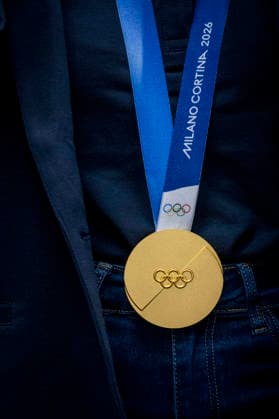 Olympic winner in snowboard parallel giant slalom Zuzana Maderova shows her gold medal during a meeting with the Governor of the Liberec Region Martin Puta, in Liberec, Czech Republic, on February 12, 2026. (CTKxPhoto RadekxPetrasek) CTKPhotoP2026021207137  CTKPhotoP2026021207137