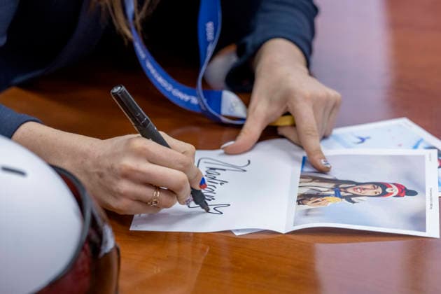 Olympic winner in snowboard parallel giant slalom Zuzana Maderova gives her autograph during a meeting with the Governor of the Liberec Region Martin Puta, in Liberec, Czech Republic, on February 12, 2026. (CTKxPhoto RadekxPetrasek) CTKPhotoP2026021207141  CTKPhotoP2026021207141