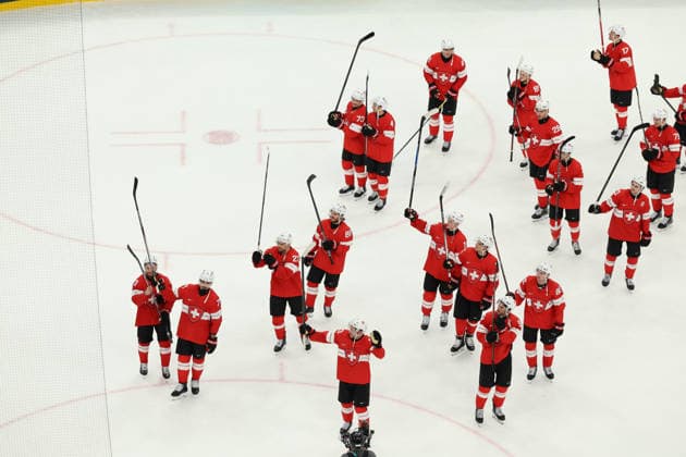 February 12, 2026, Milan, Lombardy, Italy: SWISS PLAYERS celebrate winning 4:0 against France in the Men s Preliminary Round Group A game between Team Switzerland (SUI) and Team France (FRA) at the Milano Cortina 2026 Winter Olympic Games, Olympische Spiele, Olympia, OS Olympics 2026: Milano Cortina: Ice hockey, Eishockey Men: SUI 4:0 FRA  - ZUMAc179 20260212_oly_c179_042 Copyright: xMickaelxChavetx