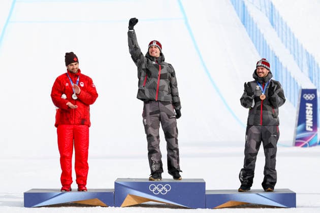OLYMPICS - Winter Olympic Games, Olympische Spiele, Olympia, OS Milano Cortina 2026 LIVIGNO,ITALY,12.FEB.26 - OLYMPICS, SNOWBOARD - Winter Olympic Games Milano Cortina 2026, Snowboard Cross, men, final, medal ceremony. Image shows the rejoicing of Eliot Grondin (CAN) and Alessandro Haemmerle (AUT) and Jakob Dusek (AUT). Keywords: medal.  GEPAxpictures xHaraldxSteiner