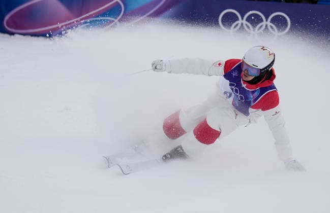 Mikael Kingsbury of Canada slides into the finish area after his final run in the Men s Freestyle Skiing Moguls competition at the Milano Cortina 2026 Winter Olympic Games, Olympische Spiele, Olympia, OS in Livigno, Italy, on Thursday, February 12, 2026. Cooper Woods of Australia won the gold medal, Kingsbury of Canada won the silver medal and Ikuma Horishima of Japan won the bronze medal.  OLY20260212815 BOBxSTRONG
