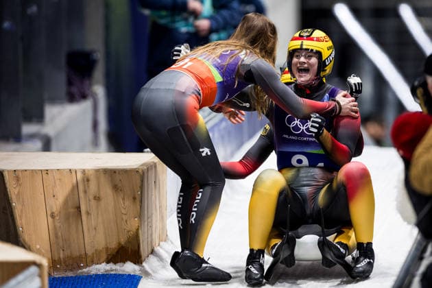 CORTINA, ITALY - FEBRUARY 12: Julia Taubitz (Germany) hugs Dajana Eitberger Magdalena Matschina (Germany) during the Luge Team Relay at the Milano Cortina 2026 Olympics at Cortina Sliding Centre on day 6 of the Milano Cortina 2026 Olympics on February 12, 2026 in Cortina, Italy. Editorial use only. Italy Copyright: xSteffiexWunderlx