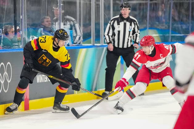 Lukas Reichel (Germany) und Jesper Jensen Aabo (Denmark) battle for the puck during the Ice hockey, Eishockey Men - Preliminary Round - Group C match between Germany v Denmark on day six of the Milano Cortina 2026 Winter Olympic Games, Olympische Spiele, Olympia, OS at Milano Rho Ice Hockey Arena on February 12, 2026 in Milan, Italy. (Photo by Alex Gottschalk DeFodi Images) - *** Lukas Reichel Germany and Jesper Jensen Aabo Denmark battle for the puck during the Ice Hockey Men Preliminary Round Group C match between Germany v Denmark on day six of the Milano Cortina 2026 Winter Olympic games at Milano Rho Ice Hockey Arena on February 12, 2026 in Milan, Italy Photo by Alex Gottschalk DeFodi Images