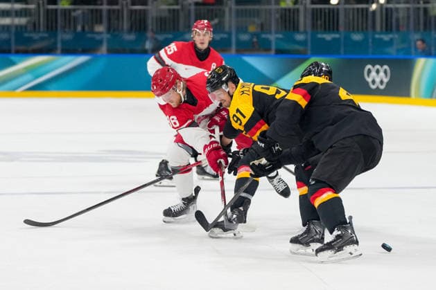 Joachim Blichfeld (Denmark) und Moritz Muller (Germany) battle for the puck during the Ice hockey, Eishockey Men - Preliminary Round - Group C match between Germany v Denmark on day six of the Milano Cortina 2026 Winter Olympic Games, Olympische Spiele, Olympia, OS at Milano Rho Ice Hockey Arena on February 12, 2026 in Milan, Italy. (Photo by Alex Gottschalk DeFodi Images) - *** Joachim Blichfeld Denmark and Moritz Muller Germany battle for the puck during the Ice Hockey Men Preliminary Round Group C match between Germany v Denmark on day six of the Milano Cortina 2026 Winter Olympic games at Milano Rho Ice Hockey Arena on February 12, 2026 in Milan, Italy Photo by Alex Gottschalk DeFodi Images
