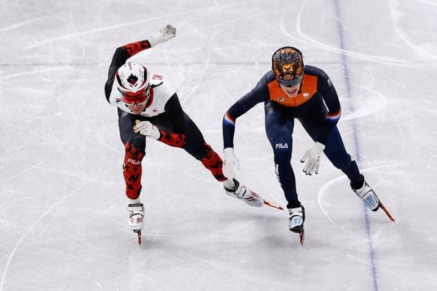 MILAN , 12-02-2026 , Milano Ice Skating Arena , Olympic Winter games, Winterspiele,Spiele, Summer games 2026 - Short Track 500m ladies - 1000m men , Picture shows William Dandjinou, Jens van t Wout Olympic Winter Games 2026 - Short Track 500m ladies - 1000m men  x201533422x Copyright: