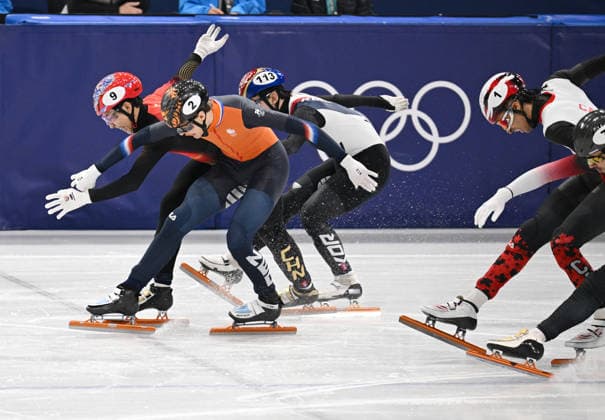 (260212) -- MILAN, Feb. 12, 2026 -- Sun Long (L) of China crosses the finish line during the short track Speed skating, Eisschnelllauf men s 1000m final A at the Milan-Cortina 2026 Olympic Winter games, Winterspiele,Spiele, Summer games in Milan, Italy, Feb. 12, 2026. ) (MICO2026)ITALY-MILAN-OLYMPIC WINTER GAMES-SHORT TRACK SPEED SKATING-MEN S 1000M-FINALS ChengxMin 