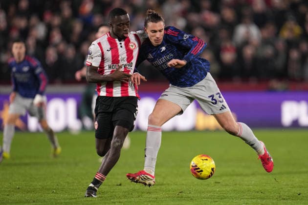 Premier League Brentford v Arsenal Riccardo Calafiori of Arsenal and Michael Kayode of Brentford battle during the Premier League match Brentford vs Arsenal at GTECH Community Stadium, London, United Kingdom on 12 February 2026 (Photo by Harvey Murphy News Images) Copyright: xHarveyxMurphy NewsxImagesx