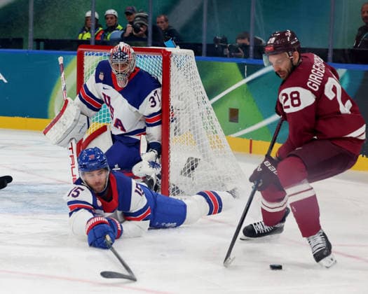February 12, 2026, Milan, Lombardy, Italy: Zemgus Girgensons 28 of Team Latvia and Noah Hanifin 15 of Team United States and Connor Hellebuyck 37 of Team United States in men s Ice hockey, Eishockey group C play during the Milano Cortina 2026 Olympic Winter games, Winterspiele,Spiele, Summer games at Milano Santagiulia Ice Hockey Arena Olympics 2026: Milano Cortina: Ice Hockey Men - Group C - LAT-USA  - ZUMAm117 20260212_oly_m117_032 Copyright: xDavidxMcIntyrex