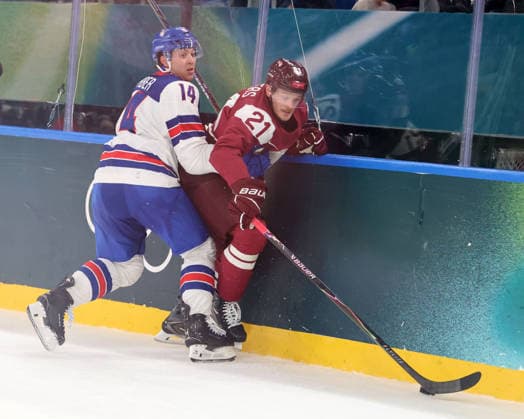 February 12, 2026, Milan, Lombardy, Italy: Rudolfs Balcers 21 of Team Latvia and Brock Faber 14 of Team United States in men s Ice hockey, Eishockey group C play during the Milano Cortina 2026 Olympic Winter games, Winterspiele,Spiele, Summer games at Milano Santagiulia Ice Hockey Arena Olympics 2026: Milano Cortina: Ice Hockey Men - Group C - LAT-USA  - ZUMAm117 20260212_oly_m117_034 Copyright: xDavidxMcIntyrex