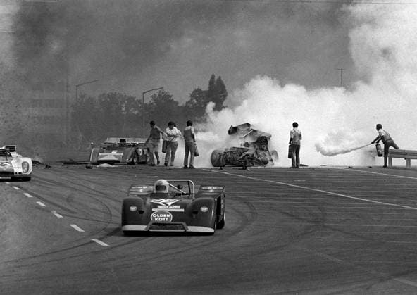 Jul 11, 1971 - Norisring, GERMANY - Track marshals attempt to extinguish the flames from the Ferrari of Pedro Rodriguez (MEX) who was killed after a crash on the first lap of the 200 mile Inter-Series race during the Inter-Series, Norisring, Germany, 11 July 1971. Copyright: xSuttonxMotorsportsx