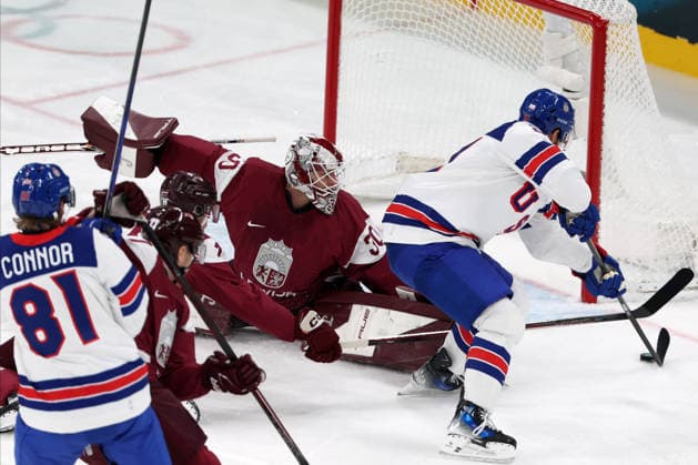 Milano Cortina 2026, Milan, Italy, 12.02, 2026, MiCo2026, MiCo, 2026, Olympics, Olympic, Winter Olympic, Olympic Winter games, Winterspiele,Spiele, Summer games Ice hockey, Eishockey Latvia, USA, United States Dylan Larkin of United States and Elvis Merzlikins of Latvia in action during men™s Premilinary round Group C Ice Hockey match between Latvia and USA teams of Milano Cortina 2026 Olympic Winter Games in Milan, Italy, 12.02.2026. Photo: Roman Koksarov (RKF) Milan Italy Copyright: xRomanxKoksarovx 0B4A2053.JPG