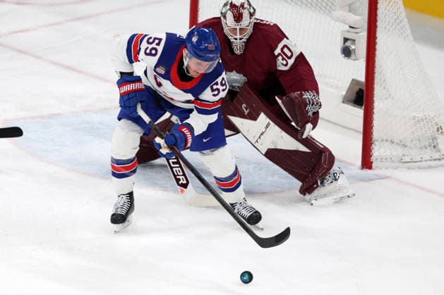 Milano Cortina 2026, Milan, Italy, 12.02, 2026, MiCo2026, MiCo, 2026, Olympics, Olympic, Winter Olympic, Olympic Winter games, Winterspiele,Spiele, Summer games Ice hockey, Eishockey Latvia, USA, United States Jake Guentzel of United States and Elvis Merzlikins of Latvia in action during men™s Premilinary round Group C Ice Hockey match between Latvia and USA teams of Milano Cortina 2026 Olympic Winter Games in Milan, Italy, 12.02.2026. Photo: Roman Koksarov (RKF) Milan Italy Copyright: xRomanxKoksarovx 0B4A2110.JPG