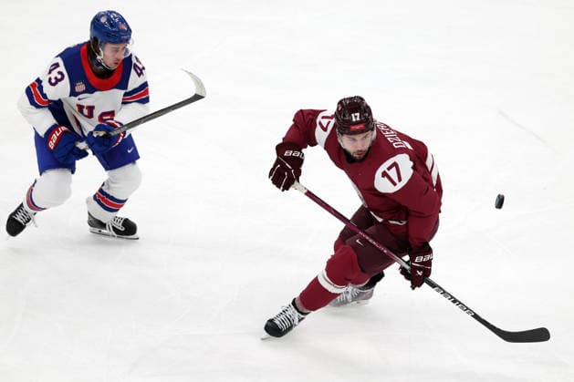Milano Cortina 2026, Milan, Italy, 12.02, 2026, MiCo2026, MiCo, 2026, Olympics, Olympic, Winter Olympic, Olympic Winter games, Winterspiele,Spiele, Summer games Ice hockey, Eishockey Latvia, USA, United States Quinn Hughes of United States and in action during men™s Premilinary round Group C Ice Hockey match between Latvia and USA teams of Milano Cortina 2026 Olympic Winter Games in Milan, Italy, 12.02.2026. Photo: Roman Koksarov (RKF) Milan Italy Copyright: xRomanxKoksarovx 0B4A2378.JPG
