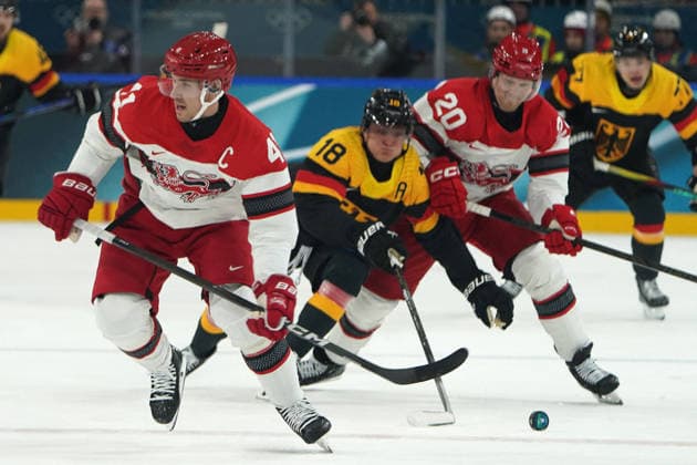 Milano Cortina, 2026 , Winter Olympic Games, Olympische Spiele, Olympia, OS Olympische Winter-Olympische spiele 2026 , Icehockey, Eishockey Männer, Men s Preliminary Round, Vorrunde, Deutschland vs Dänemark, Germany vs Denmark , ce Hockey Arena Milano Mailand Jesper Jensen Aabo, dEN Tim Stutzle, Deutschland, Germany, Lars Eller, DENPhotocopyright Gladys Chai von der Laage *** Milano Cortina, 2026 , Winter Olympic Games, Winter Olympic Games 2026 , Icehockey, Icehockey Men, Men s Preliminary Round, Preliminary Round, Germany vs Denmark, Germany vs Denmark , ce Hockey Arena Milano Milano Jesper Jensen Aabo, dEN Tim Stutzle, Germany, Germany, Lars Eller, DENPhotocopyright Gladys Chai von der Laage