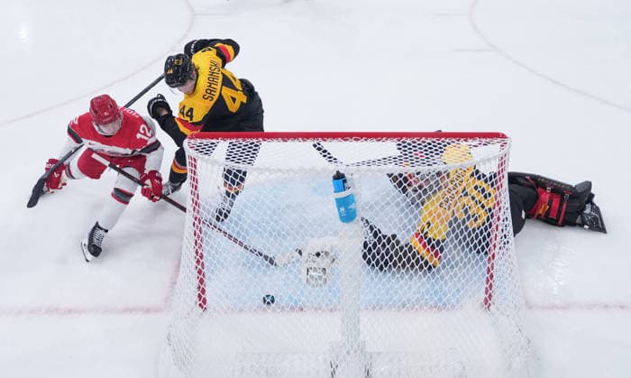 (260213) -- MILAN, Feb. 13, 2026 -- Oscar Moelgaard (L) of Denmark competes during the Ice hockey, Eishockey men s preliminary round group C match between Denmark and Germany at the Milan-Cortina 2026 Olympic Winter games, Winterspiele,Spiele, Summer games in Milan, Italy, Feb. 12, 2026. ( Pool via Xinhua) (MICO2026)ITALY-MILAN-OLYMPIC WINTER GAMES-ICE HOCKEY-MEN-PRELIMINARY-DEN VS GER WangxKaiyan 