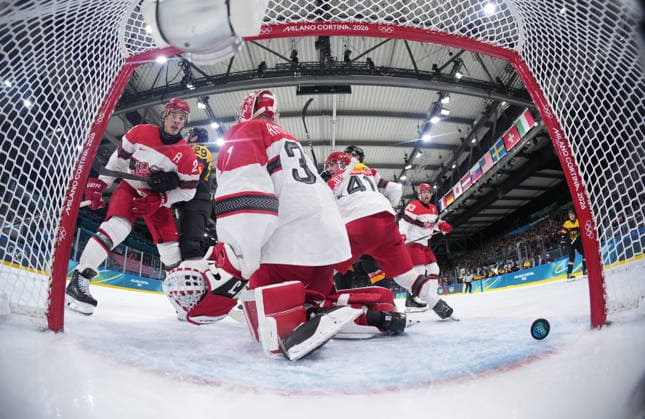 (260213) -- MILAN, Feb. 13, 2026 -- Frederik Andersen (C), goalkeeper of Denmark, fails to save a goal during the Ice hockey, Eishockey men s preliminary round group C match between Denmark and Germany at the Milan-Cortina 2026 Olympic Winter games, Winterspiele,Spiele, Summer games in Milan, Italy, Feb. 12, 2026. ) (MICO2026)ITALY-MILAN-OLYMPIC WINTER GAMES-ICE HOCKEY-MEN-PRELIMINARY-DEN VS GER WangxKaiyan 