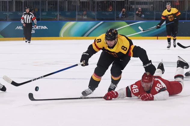 (260213) -- MILAN, Feb. 13, 2026 -- Tobias Rieder (L) of Germany competes against Nicholas B Jensen of Denmark during the Ice hockey, Eishockey men s preliminary round group C match between Denmark and Germany at the Milan-Cortina 2026 Olympic Winter games, Winterspiele,Spiele, Summer games in Milan, Italy, Feb. 12, 2026. ) (MICO2026)ITALY-MILAN-OLYMPIC WINTER GAMES-ICE HOCKEY-MEN-PRELIMINARY-DEN VS GER WangxKaiyan 