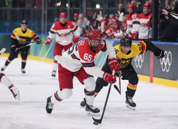 (260213) -- MILAN, Feb. 13, 2026 -- Marc Michaelis (L) of Germany vies against Denmark s Christian Wejse during the Ice hockey, Eishockey men s preliminary round group C match between Denmark and Germany at the Milan-Cortina 2026 Olympic Winter games, Winterspiele,Spiele, Summer games in Milan, Italy, Feb. 12, 2026. ) (MICO2026)ITALY-MILAN-OLYMPIC WINTER GAMES-ICE HOCKEY-MEN-PRELIMINARY-DEN VS GER WangxKaiyan 