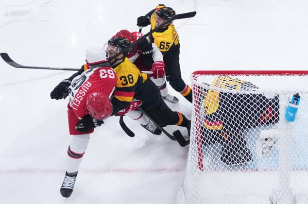 (260213) -- MILAN, Feb. 13, 2026 -- Players of both teams compete during the Ice hockey, Eishockey men s preliminary round group C match between Denmark and Germany at the Milan-Cortina 2026 Olympic Winter games, Winterspiele,Spiele, Summer games in Milan, Italy, Feb. 12, 2026. ( Pool via Xinhua) (MICO2026)ITALY-MILAN-OLYMPIC WINTER GAMES-ICE HOCKEY-MEN-PRELIMINARY-DEN VS GER WangxKaiyan 