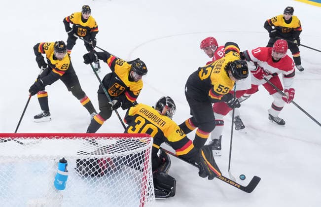 (260213) -- MILAN, Feb. 13, 2026 -- Philip Grubauer (4th L), goalkeeper of Germany, tries to save during the Ice hockey, Eishockey men s preliminary round group C match between Denmark and Germany at the Milan-Cortina 2026 Olympic Winter games, Winterspiele,Spiele, Summer games in Milan, Italy, Feb. 12, 2026. ( Pool via Xinhua) (MICO2026)ITALY-MILAN-OLYMPIC WINTER GAMES-ICE HOCKEY-MEN-PRELIMINARY-DEN VS GER WangxKaiyan 