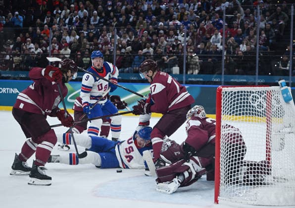 (260213) -- MILAN, Feb. 13, 2026 -- Players of both teams compete during the Ice hockey, Eishockey men s preliminary round group C match between the United States and Latvia at the Milan-Cortina 2026 Olympic Winter games, Winterspiele,Spiele, Summer games in Milan, Italy, Feb. 12, 2026. ) (MICO2026)ITALY-MILAN-OLYMPIC WINTER GAMES-ICE HOCKEY-MEN-PRELIMINARY-USA VS LAT ZhangxHaofu 