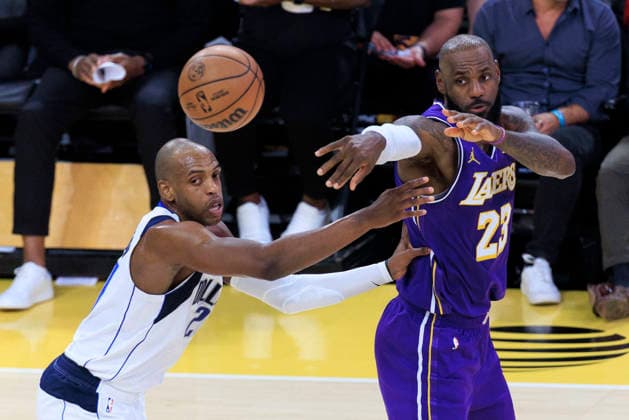February 12, 2026, Los Angeles, California, USA: LeBron James 23 of the Los Angeles Lakers passes the ball as Khris Middleton 20 of the Dallas Mavericks defends during their regular season NBA, Basketball Herren, USA game on Thursday February 12, 2026 at Crypto.com Arena in Los Angeles, California. Lakers defeat Mavericks, 124-104. ARIANA RUIZ PI Los Angeles USA - ZUMAp124 20260212_zaa_p124_061 Copyright: xArianaxRuizx