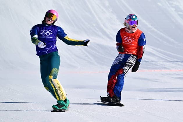 XXV Winter Olympic Games, Olympische Spiele, Olympia, OS in Livigno, Italy, on February 13, 2026. Snowboard Women s Snowboard Cross, Semifinals. L-R Josie Baff of Australia and Eva Adamczykova of Czech Republic. (CTKxPhoto DavidxTanecek) CTKPhotoP2026021305779  CTKPhotoP2026021305779