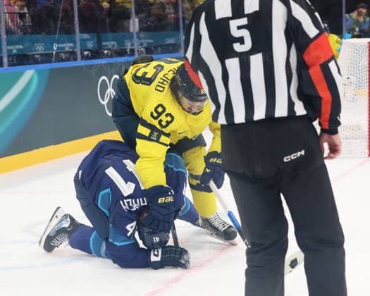 February 13, 2026, Milan, Lombardy, Italy: Mika Zibanejad 93 of Team Sweden and Miro Heiskanen 41 of Team Finland fight during a Group B men s Ice hockey, Eishockey game during the Milano Cortina 2026 Olympic Winter games, Winterspiele,Spiele, Summer games at Milano Santagiulia Ice Hockey Arena Milan Italy - ZUMAm117 20260213_oly_m117_019 Copyright: xDavidxMcIntyrex