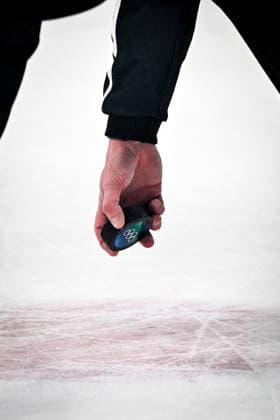 MILAN, ITALY - FEBRUARY 13: A linesman picks up the puck before a faceoff during the Men™s Prelim Round match between France and Czech Republic on day seven of the Milano Cortina 2026 Winter Olympic Games, Olympische Spiele, Olympia, OS at Milano Santagiulia IHO Arena on February 13, 2026 in Milan, Italy. Milan Milano Santagiulia IHO Arena Italy *** MILAN, ITALY FEBRUARY 13 A linesman picks up the puck before a faceoff during the Men™s Prelim Round match between France and Czech Republic on day seven of the Milano Cortina 2026 Winter Olympic games at Milano Santagiulia IHO Arena on February 13, 2026 in Milan, Italy Milan Milano Santagiulia IHO Arena Italy Copyright: xJustPictures.ch AndreaxBrancax jp-en-EuSpIm-AB-AAB_393113022026