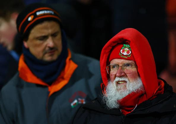 A Wrexham fan looks on Wrexham v Ipswich Town, Emirates FA Cup, Fourth Round, Football, SToK Cae Ras, Wrexham, UK - 13 Feb 2026Wrexham SToK Cae Ras United Kingdom EDITORIAL USE ONLY No use with unauthorised audio, video, data, fixture lists, club league logos or live services. Online in-match use limited to 120 images, no video emulation. No use in betting, games or single club league player publications. Copyright: xMattxWest Shutterstockx 16593547v