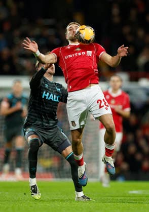 Wrexham, Wales, 13th February 2026. Dan Neil of Ipswich Town tussles with Sam Smith of Wrexham during the Wrexham vs Ipswich Town FA Cup fourth round match at the SToK Car Ras, Wrexham. Picture credit should read: Cody Froggatt Sportimage EDITORIAL USE ONLY. No use with unauthorised audio, video, data, fixture lists, club league logos or live services. Online in-match use limited to 120 images, no video emulation. No use in betting, games or single club league player publications. SPI_019_CF_WREXHAM_V_IPSWICH SPI-4531-0018