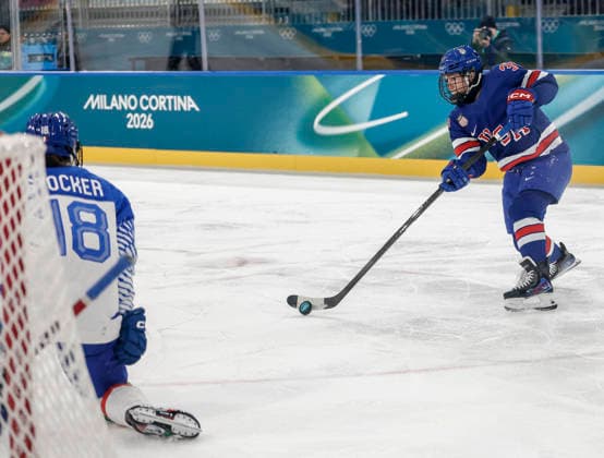 United States Abbey Murphy (37) shoot on Italy s Franziska Stocker (18) during the Women s Playoff Quarterfinal game between Italy and the USA at the Milano Rho Ice hockey, Eishockey Arena in Milan, Italy, on Friday, February 13, 2026.  OLY202602138603 AARONxJOSEFCZYK