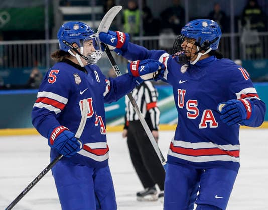 United States Megan Keller (5) celebrates scoring a goal with United States Laila Edwards (10) during the Women s Playoff Quarterfinal game between Italy and the USA at the Milano Rho Ice hockey, Eishockey Arena in Milan, Italy, on Friday, February 13, 2026.  OLY2026021386010 AARONxJOSEFCZYK