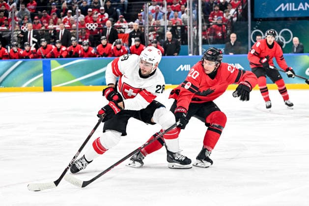 MILAN, ITALY - FEBRUARY 13: Timo Meier of Switzerland protects the puck from Thomas Harley of Canada during the Men™s Prelim Round match between Canada and Switzerland on day seven of the Milano Cortina 2026 Winter Olympic Games, Olympische Spiele, Olympia, OS at Milano Santagiulia IHO Arena on February 13, 2026 in Milan, Italy. Milan Milano Santagiulia IHO Arena Italy *** MILAN, ITALY FEBRUARY 13 Timo Meier of Switzerland protects the puck from Thomas Harley of Canada during the Men™s Prelim Round match between Canada and Switzerland on day seven of the Milano Cortina 2026 Winter Olympic games at Milano Santagiulia IHO Arena on February 13, 2026 in Milan, Italy Milan Milano Santagiulia IHO Arena Italy Copyright: xJustPictures.ch AndreaxBrancax jp-en-EuSpIm-AB-AAB_517213022026
