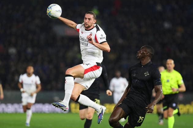 Adrien Rabiot of AC Milan and Idrissa Toure of AC Pisa Calcio 1909 compete for the ball during the serie A match between SC Pisa Calcio 1909 and AC Milan at Arena Garibaldi - Romeo Anconetani - Cetilar Arena Stadium in Pisa (Italy), February 13, 2026. massimilianoxcarnabuci