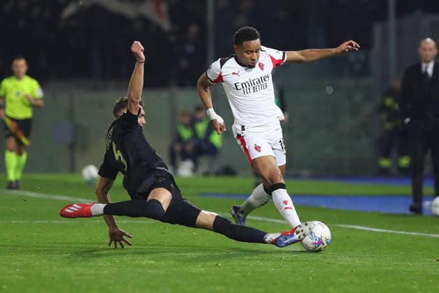 Simone Canestrelli of AC Pisa Calcio 1909 in action with a tackle on Christopher Nkunku of AC Milan during the serie A match between SC Pisa Calcio 1909 and AC Milan at Arena Garibaldi - Romeo Anconetani - Cetilar Arena Stadium in Pisa (Italy), February 13, 2026. massimilianoxcarnabuci