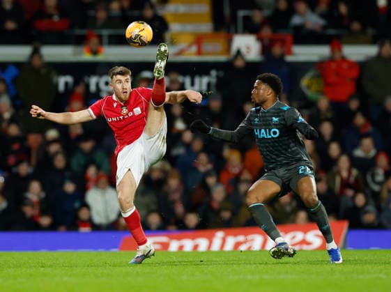 Wrexham, Wales, 13th February 2026. George Thomason of Wrexham and Chuba Akpom of Ipswich Town during the Wrexham vs Ipswich Town FA Cup fourth round match at the SToK Car Ras, Wrexham. Picture credit should read: Cody Froggatt Sportimage EDITORIAL USE ONLY. No use with unauthorised audio, video, data, fixture lists, club league logos or live services. Online in-match use limited to 120 images, no video emulation. No use in betting, games or single club league player publications. SPI_036_CF_WREXHAM_V_IPSWICH SPI-4531-0037