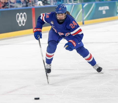 United States Joy Dunne (24) chases the puck in the second period of the Women s Playoff Quarterfinal game between Italy and the USA at the Milano Rho Ice hockey, Eishockey Arena in Milan, Italy, on Friday, February 13, 2026.  OLY202602138622 AARONxJOSEFCZYK